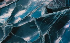 a close up of a broken glass window