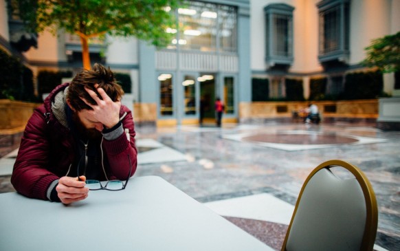 Man holding his head 