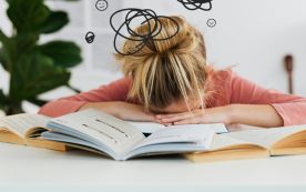 Woman Putting Her Head Down on the Desk