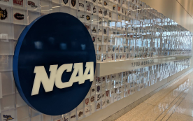 NCAA basketball game in progress as federal prosecutors reveal 26 